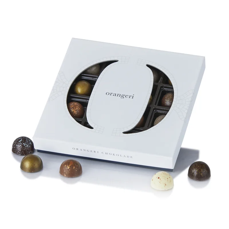 Fyldte chokoladestykker i Orangeri æske - 144g